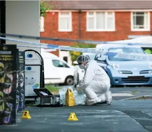  ?? Adam Vaughan ?? ●●A forensics officer at the scene on Worcester Road in Cheadle Hulme
