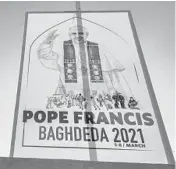  ?? ZAID AL-OBEIDI/GETTY-AFP ?? A sign welcomes the pope Sunday outside a Catholic church in Iraq. The March 5-8 trip is expected to provide a spiritual boost to Iraq’s Christians.