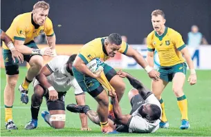  ??  ?? Australia prop Scott Sio, centre, in action against Fiji during their Pool D match at the Rugby World Cup.
