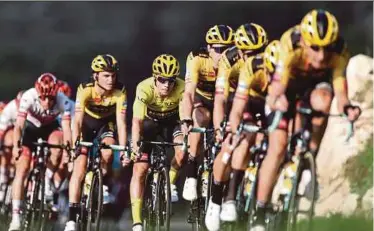  ?? AFP PIC ?? Team Jumbo rider, Primoz Roglic (third from left), wearing the overall leader's yellow jersey during the 16th stage of the Tour de France on Tuesday.