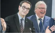  ?? PETER McCABE ?? Health Minister Gaétan Barrette, right, laughs alongside Eric Maldoff as they announce the creation of an English-language committee responsibl­e for maintainin­g access to health and social services.