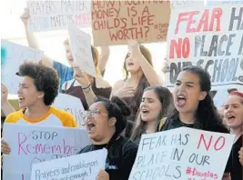  ?? MIKE STOCKER/STAFF PHOTOGRAPH­ER ?? Students from South Broward High School attend a rally Saturday at the Federal Courthouse in Fort Lauderdale to demand government action on firearms.