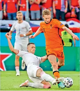  ?? — AP ?? Czech Republic’s Tomas Holes (left) challenges Joel Veltman of the Netherland­s during their Euro Round of 16 match at the Ferenc Puskas stadium in Budapest, Hungary, on Sunday.