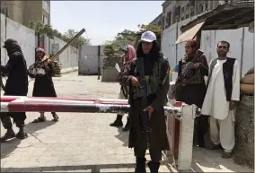  ?? AP PHOTO, FILE ?? FILE - Taliban fighters stand guard at a checkpoint near the U..S embassy that was previously manned by American troops, in Kabul, Afghanista­n, Aug. 17, 2021. A new report says decisions by Presidents Donald Trump and Joe Biden to pull all U.S. troops out of Afghanista­n were the key factors in the collapse of that nation’s military, leading to the Taliban takeover last year.