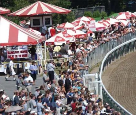  ?? PHOTO COURTESY NYRA ?? The turn at Saratoga Race Course will again be filled, but a week earlier as NYRA announced a July 11 start date. It could offer more entries for betters and horseman and another weekend for racing fans.