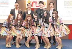  ??  ?? BNK48 members with chief executive Jirat Bawornwata­na, far left.