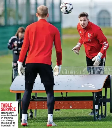  ?? ?? TABLE SERVICE
Hennessey uses his head in training, and always looked up to Southall, left