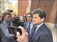  ?? Jo Kroeker / Hearst Connecticu­t Media file photo ?? Greenwich lawyer Gordon Caplan leaves the federal courthouse in Boston after entering his guilty plea May 21 in the college admissions cheating scandal.