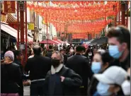  ?? (AP/Alberto Pezzali) ?? People get out to eat at restaurant­s Saturday in London’s Chinatown. Shops, gyms, hairdresse­rs, restaurant patios and beer gardens reopened Monday after months of lockdown.