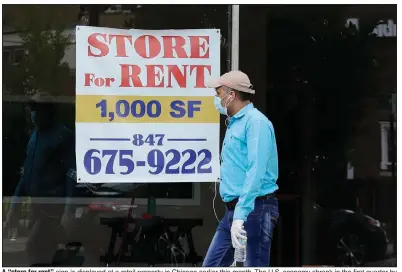  ?? (AP/Nam Y. Huh) ?? A “store for rent” sign is displayed at a retail property in Chicago earlier this month. The U.S. economy shrank in the first quarter by the most since the fourth quarter of 2008.