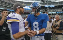  ?? ADAM HUNGER ?? Minnesota Vikings quarterbac­k Kirk Cousins (8) and New York Giants quarterbac­k Daniel Jones (8) talk after playing each other in an NFL football game, Sunday, Oct. 6, 2019, in East Rutherford, N.J.