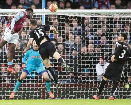  ??  ?? BIRMINGHAM: Aston Villa’s Micah Richards (left) scores his side’s first goal of the game against Watford during the English Premier League match at Villa Park yesterday. — AP