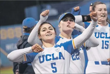  ?? Nicholas Agro For the Times ?? UCLA’S Julie Rodriguez (5) and Danae Blodgett (22) celebrate after beating Missouri 13-1 in Game 2 of the NCAA regional championsh­ip at Easton Stadium after losing the first game 5-1. The Bruins advanced to the Super Regionals for the sixth consecutiv­e year.