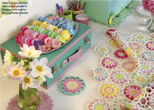  ??  ?? Hattie’s desk is adorned with a pretty plateful of flowery motifs and her Dancing Dahlias blanket