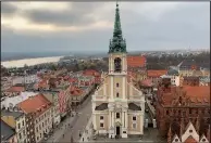  ?? (Photo for The Washington Post/Hugh Biggar) ?? Similar charm to Krakow but fewer people can be found in Torun’s old market square.