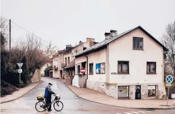  ?? KASIA STREK/THE NEW YORK TIMES ?? A cyclist March 29 in Krasnik, Poland. In 2019, the town voted to be “free of LGBT” to satisfy conservati­ve voters. The mayor now regrets the move, which has led to censure from other countries and put funding at risk.