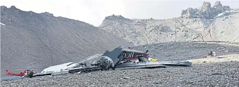  ?? AFP ?? Wreckage of a Junkers Ju-52 aircraft is pictured in Flims after it crashed into Piz Segnas, a 3,000-metre peak in eastern Switzerlan­d on Saturday.