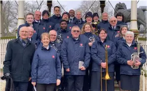  ?? Picture: Phil Creighton ?? Michael Penny (left) with members of the Reading Central Salvation Army band and Major Beth Maddern following the Easter Sunday open-air service in Forbury Gardens