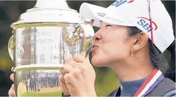  ?? ERIC GAY/AP ?? A Lim Kim kisses the trophy after winning the U.S. Women’s Open on Monday.