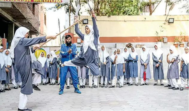  ?? Agence France-presse ?? ↑
Girls practice a Vietnamese martial art of self-defence at St Maaz high school in Hyderabad on Thursday.
