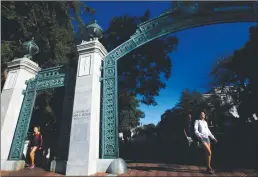  ?? Los Angeles Times/tns ?? Students walk through the Sather Arch in the early morning light on the campus of the University of California at Berkeley in September 2015.