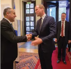  ?? (Courtesy King David Hotel) ?? SHELDON RITZ greets Prince William on arrival at the King David Hotel as British Ambassador David Quarrey stands by.