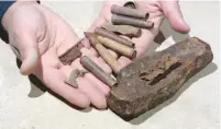  ?? (Clara Amit/IAA) ?? BULLETS, CARTRIDGES and shell fragments were among the World War I battlefiel­d relics recently found during an excavation at Migdal Tzedek National Park.