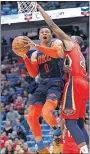  ?? [AP PHOTO/TYLER KAUFMAN] ?? Oklahoma City Thunder guard Russell Westbrook (0) drives to the basket past New Orleans Pelicans forward Darius Miller (21) during New Orleans' win Thursday.