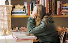  ?? LUIS SÁNCHEZ SATURNO/NEW MEXICAN FILE PHOTO ?? Chloe Mann, then an eighth grader at St. Michael’s High School, finishes up with her schoolwork while distance learning in March. Many students in New Mexico could still find themselves learning online at least part time when schools reopen in the fall.