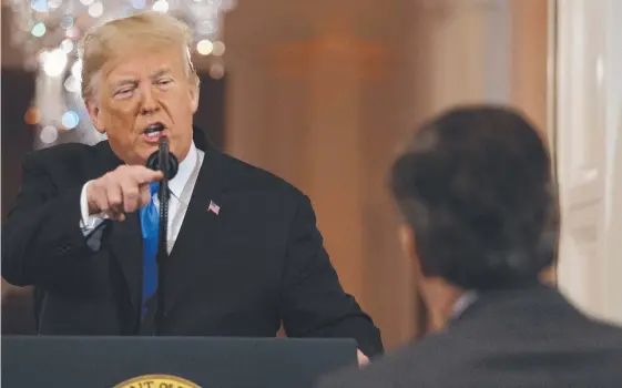  ?? Picture: AP PHOTO ?? Donald Trump takes on CNN journalist Jim Acosta at a White House press conference. The journalist’s press pass was later suspended.