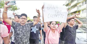  ??  ?? This photo shows Indian protesters demanding the arrest and punishment of people involved in the killing of two men in Karbi Anglong district, during a protest in Guwahati, the capital city of India’s northeaste­rn state of Assam.