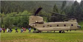  ??  ?? In this photo provided by the Montana Army National Guard, middle school students from the Montana Wilderness School of the Bible, attending a Bible camp along the Rocky Mountain Front, are guided onto a Chinook helicopter. MONTANA ARMy NATIONAL GUARD...