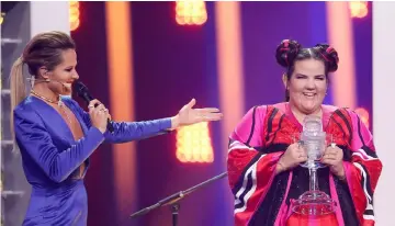  ??  ?? Israel’s Netta reacts as she wins the Grand Final of Eurovision Song Contest 2018 at the Altice Arena hall in Lisbon, Portugal, May 12. — Reuters photo