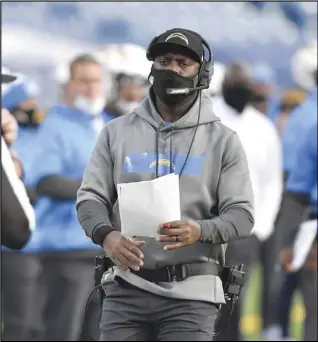  ?? Associated Press ?? SECOND GUESSED — Los Angeles Chargers head coach Anthony Lynn works the sideline during the second half against the Buffalo Bills on Sunday in Orchard Park, N.Y. Lynn made some questionab­le play calls in the Chargers’ 27-17 loss.