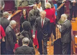  ?? | RICH SAAL/ THE STATE JOURNAL- REGISTER VIA AP ?? Gov. Bruce Rauner approaches the speaker’s dais in the House Chamber to deliver his budget address Wednesday at the Capitol.