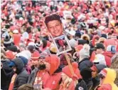  ?? REED HOFFMAN/AP ?? Fans take in the Chiefs’ Super Bowl victory celebratio­n and parade Wednesday in Kansas City, Missouri. The Chiefs rallied past the Eagles 38-35 on Sunday.