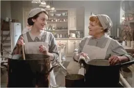  ?? BEN BLACKALL/©2021 FOCUS FEATURES, LLC ?? Sophie McShera (left) as Daisy and Lesley Nicol as Mrs. Patmore in “Downton Abbey: A New Era.”