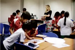  ??  ?? Students are focused, engaged and working collaborat­ively with iPads under the 1: 1 iPad programme at Garden Internatio­nal School.