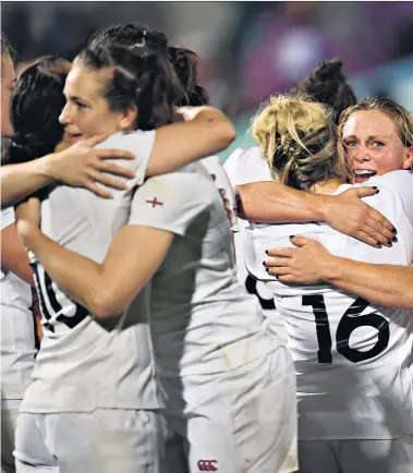  ??  ?? Together as one: England players celebrate their semi-final victory over France on Tuesday