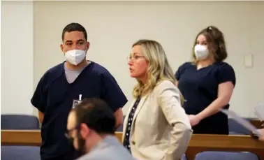  ?? BETH SCHLANKER/THE PRESS DEMOCRAT VIA AP ?? Evan Frostick, left, and Madison Bernard, right, both charged with murder and child cruelty in the death of their daughter, Charlotte Frostick, appear in 2022 before a judge at the Sonoma County Superior Court in Santa Rosa, Calif.