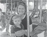  ?? FAMILY PHOTO ?? Jessica Butler poses on a carousel with her son Max. Jessica Butler's family says she was suffering extreme pain during her pregnancy but was sent home without seeing a doctor. She and her unborn baby died.