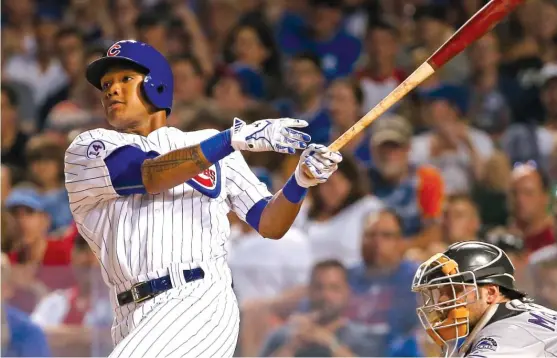  ?? | GETTY IMAGES ?? Addison Russell hit 13 home runs in 475 at-bats as a rookie last season. “This year, with just under a year under my belt, I’mseeing the ball a lot better,” Russell said.