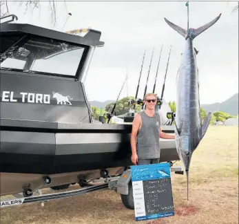  ?? PICTURE / SUPPLIED ?? Tomas Taylor weighs in a 101kg striped marlin caught on board El Toro (skipper Marcus Te Brake) on day two of the Best of the West tournament.