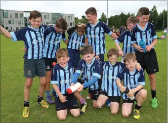  ??  ?? The Leopardsto­wn Dublin team celebrate after beating St Patrick’s Cavan in the U-11 Mini Rugby final