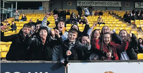  ?? ?? Cheers Some of the local children who were given a free ticket for the Livingston match