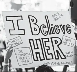  ?? MARY SCHWALM/AP ?? A protester holds a sign during a rally against Brett Kavanaugh on Monday in Boston.