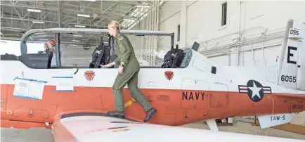  ??  ?? Lt. Ashley Hallford instructs flight students in the Navy’s T-6 B training aircraft.