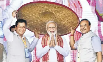  ?? ANI ?? PM Narendra Modi with Assam CM Himanta Biswa Sarma and Union minister Sarbananda Sonowal.