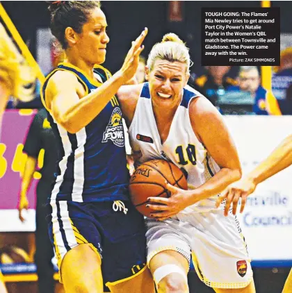  ?? Picture: ZAK SIMMONDS ?? TOUGH GOING: The Flames’ Mia Newley tries to get around Port City Power's Natalie Taylor in the Women’s QBL match between Townsville and Gladstone. The Power came away with the win.