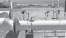  ?? ?? Carbon capture pipelines like this one in west Texas inject liquefied carbon dioxide gas, in this case obtained from natural gas processing plants, into oil-bearing rock layers to force out petroleum. Pipelines planned in Iowa and surroundin­g states would collect the gas from ethanol plants and other agricultur­al industrial facilities and permanentl­y inject it into storage sites in North Dakota and Illinois.